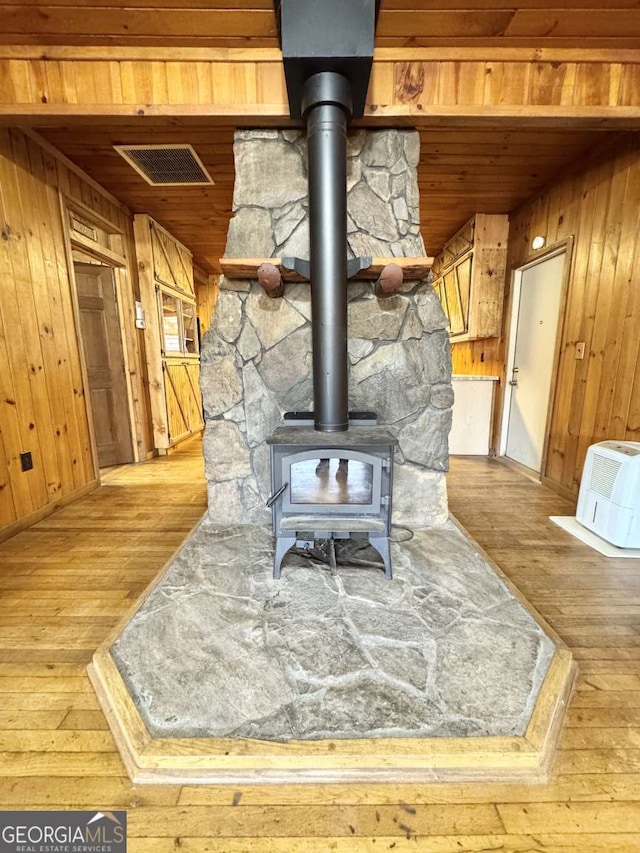 456 Pickelsimer Rd, Blairsville, GA 30512 - detailed view of wooden ceiling, wood finished floors, wooden walls, and a wood stove