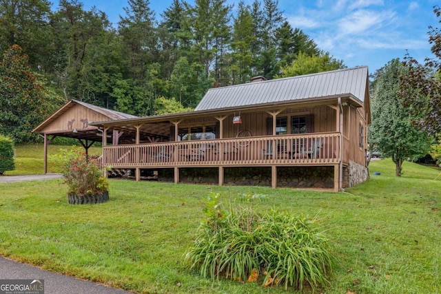 456 Pickelsimer Rd, Blairsville, GA 30512 - view of front of house featuring a front lawn, metal roof, covered porch, a chimney, and board and batten siding