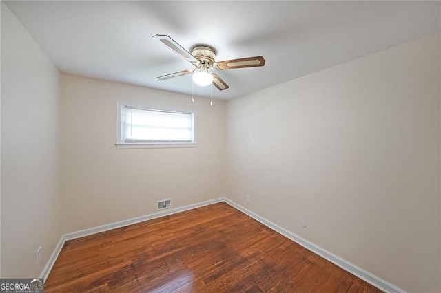 629 Birchwood Rd, Marietta, GA 30060 - empty room featuring baseboards, wood-type flooring, and a ceiling fan