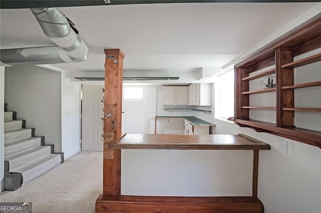 629 Birchwood Rd, Marietta, GA 30060 - kitchen featuring light carpet and white cabinetry