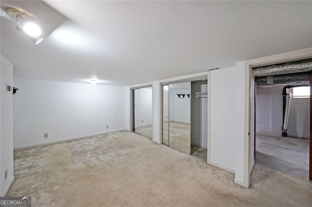 629 Birchwood Rd, Marietta, GA 30060 - unfurnished bedroom featuring multiple closets, light colored carpet, and baseboards