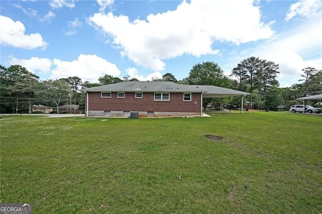 629 Birchwood Rd, Marietta, GA 30060 - back of property with a lawn, brick siding, and central air condition unit