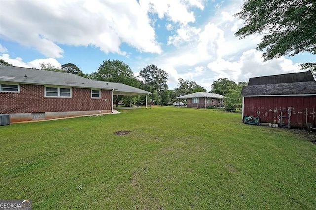 629 Birchwood Rd, Marietta, GA 30060 - view of green lawn with a barn, central AC, and an outbuilding