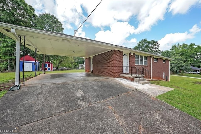 629 Birchwood Rd, Marietta, GA 30060 - view of front of house with a front yard, driveway, brick siding, and a carport