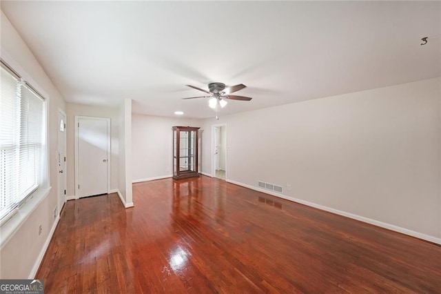 629 Birchwood Rd, Marietta, GA 30060 - empty room with ceiling fan, wood finished floors, and baseboards