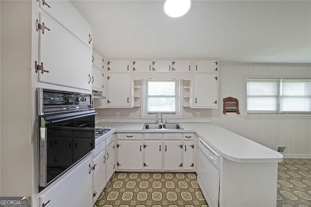629 Birchwood Rd, Marietta, GA 30060 - kitchen with white appliances, a sink, open shelves, a peninsula, and healthy amount of natural light