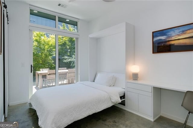 53 Daniel St SE, Atlanta, GA 30312 - bedroom featuring concrete flooring, access to outside, and a desk
