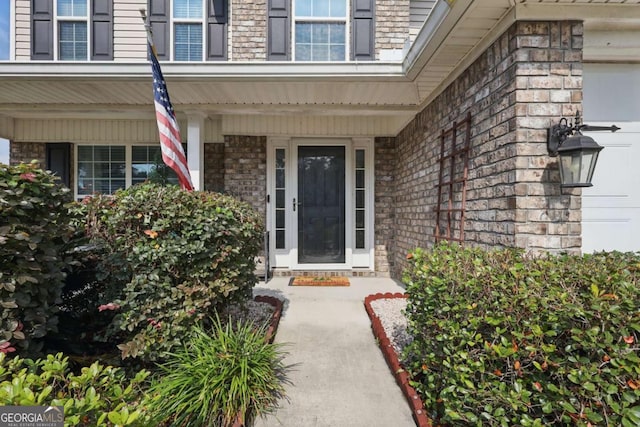 309 Nashview Trl, Allenhurst, GA 31301 - doorway to property with a porch and brick siding