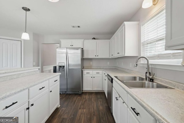 309 Nashview Trl, Allenhurst, GA 31301 - kitchen featuring stainless steel appliances, a sink, dark wood-style flooring, and white cabinets