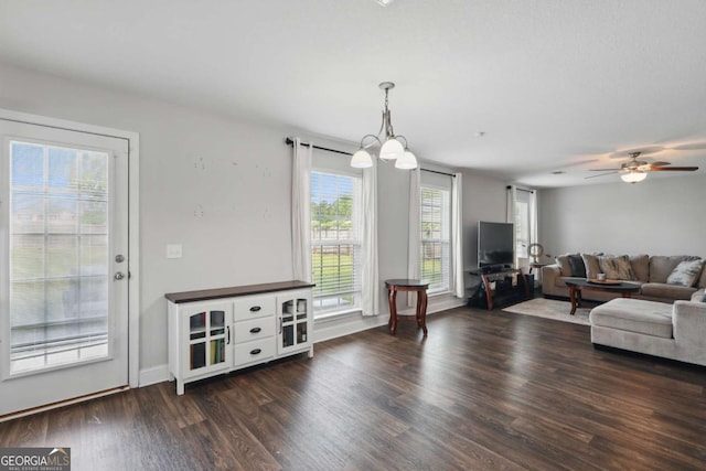 309 Nashview Trl, Allenhurst, GA 31301 - living area with wood finished floors, ceiling fan, baseboards, and a chandelier
