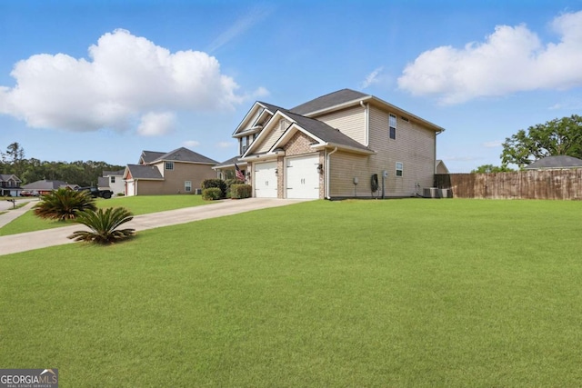 309 Nashview Trl, Allenhurst, GA 31301 - view of front of home with concrete driveway, central AC unit, and a garage