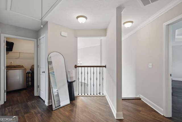 309 Nashview Trl, Allenhurst, GA 31301 - corridor featuring washer / clothes dryer, attic access, wood finished floors, baseboards, and an upstairs landing