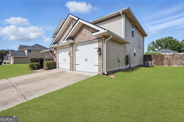 309 Nashview Trl, Allenhurst, GA 31301 - view of side of home with an attached garage, driveway, stone siding, and central air condition unit