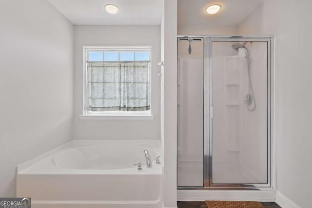 309 Nashview Trl, Allenhurst, GA 31301 - full bathroom featuring a stall shower and a garden tub