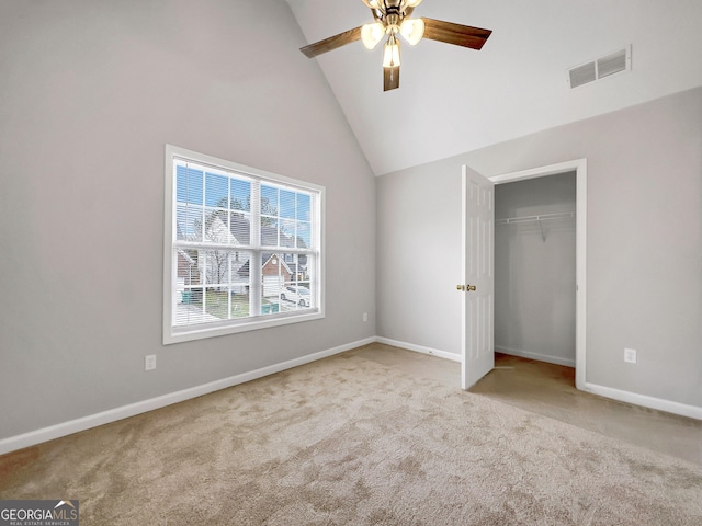 7006 Mahonia Pl, Lithonia, GA 30038 - unfurnished bedroom featuring carpet floors, lofted ceiling, a closet, baseboards, and a ceiling fan