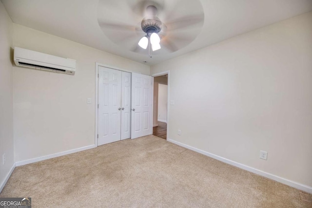1693 Montreal Rd, Tucker, GA 30084 - unfurnished bedroom with an AC wall unit, carpet floors, baseboards, a closet, and a ceiling fan
