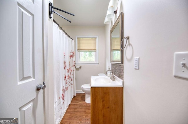 1693 Montreal Rd, Tucker, GA 30084 - bathroom featuring toilet, wood finished floors, vanity, and curtained shower