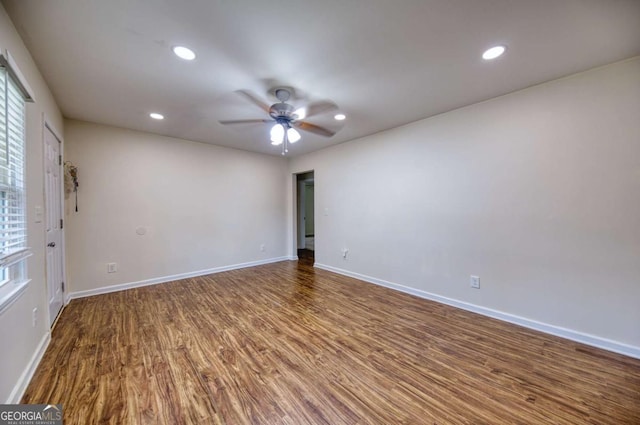 1693 Montreal Rd, Tucker, GA 30084 - empty room with wood finished floors, ceiling fan, recessed lighting, and baseboards