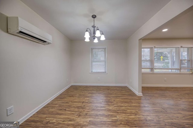 1693 Montreal Rd, Tucker, GA 30084 - unfurnished dining area with a wall mounted AC, dark wood-type flooring, a chandelier, plenty of natural light, and recessed lighting