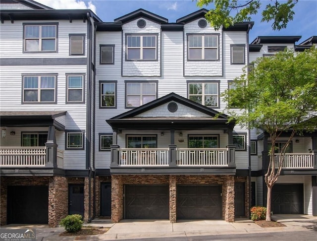 221 Semel Cir NW Unit 273, Atlanta, GA 30309 - multi unit property featuring a garage, a balcony, and driveway