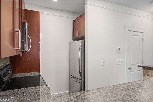 221 Semel Cir NW Unit 273, Atlanta, GA 30309 - kitchen with appliances with stainless steel finishes and brown cabinets