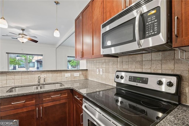 221 Semel Cir NW Unit 273, Atlanta, GA 30309 - kitchen with stainless steel appliances, a sink, a ceiling fan, and tasteful backsplash