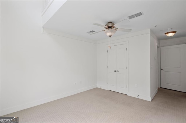 221 Semel Cir NW Unit 273, Atlanta, GA 30309 - unfurnished bedroom featuring light carpet, baseboards, a closet, and ceiling fan
