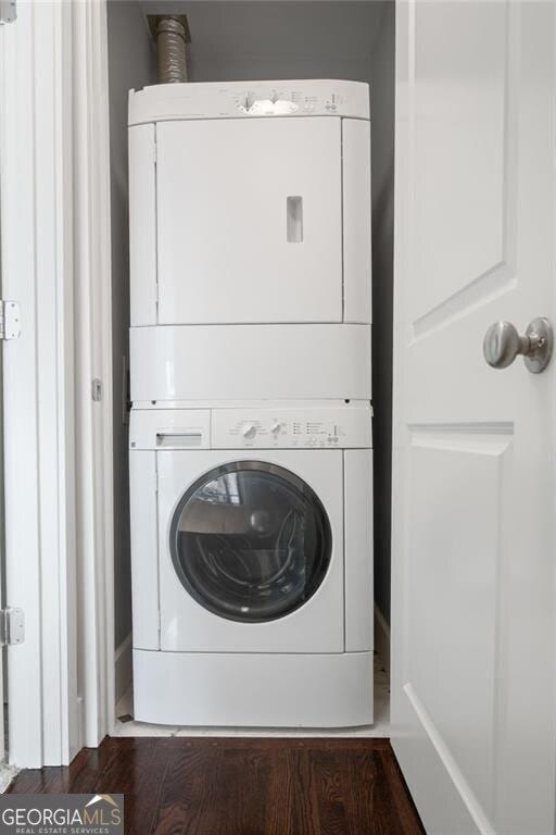 221 Semel Cir NW Unit 273, Atlanta, GA 30309 - laundry area with stacked washer / drying machine and wood finished floors