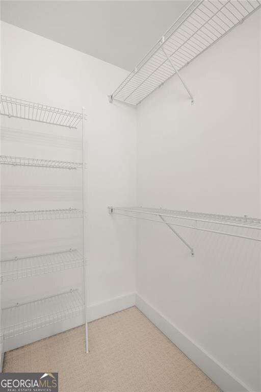 221 Semel Cir NW Unit 273, Atlanta, GA 30309 - walk in closet featuring tile patterned floors