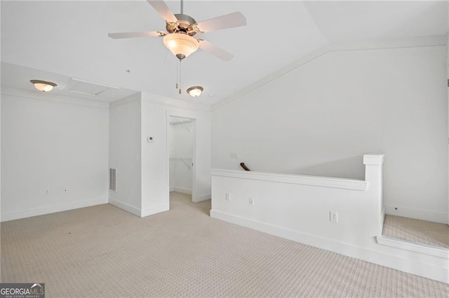 221 Semel Cir NW Unit 273, Atlanta, GA 30309 - unfurnished bedroom with carpet flooring, vaulted ceiling, a walk in closet, a closet, and ceiling fan