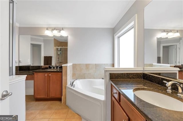 2690 Derby Walk NE Unit 53, Atlanta, GA 30319 - bathroom with ornamental molding, tile patterned floors, a stall shower, a garden tub, and two vanities