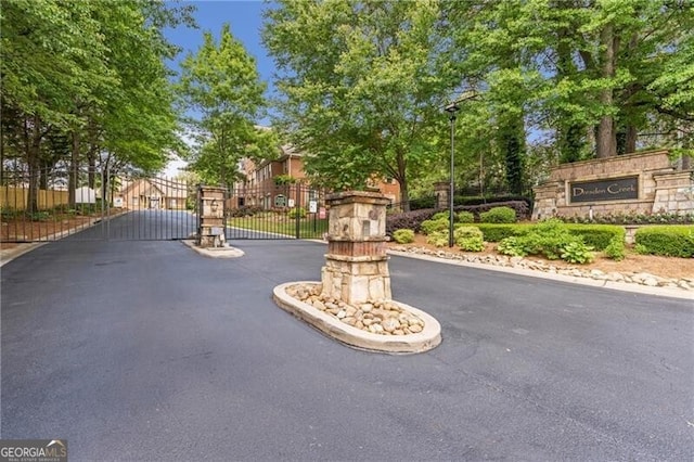 2690 Derby Walk NE Unit 53, Atlanta, GA 30319 - view of asphalt street featuring a gate, a gated entry, and street lighting