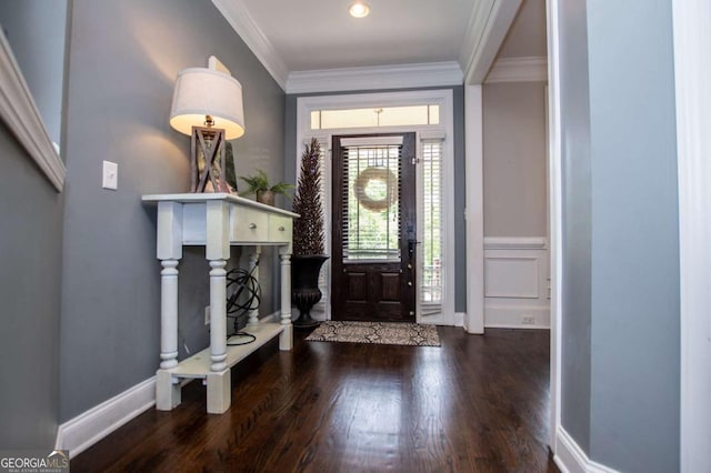 entrance foyer with wood finished floors, crown molding, and baseboards