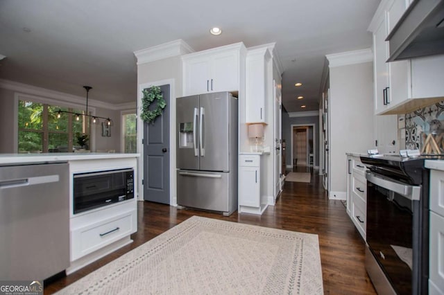 kitchen featuring appliances with stainless steel finishes, crown molding, light countertops, range hood, and white cabinets