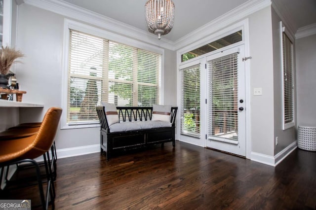 sitting room with baseboards, a chandelier, wood finished floors, and ornamental molding