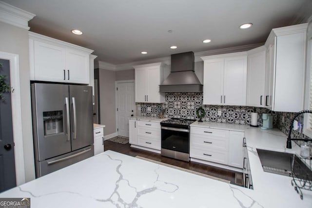 kitchen with stainless steel appliances, custom exhaust hood, a sink, white cabinets, and recessed lighting