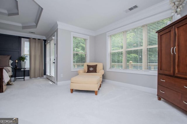 sitting room featuring ornamental molding, light carpet, and baseboards