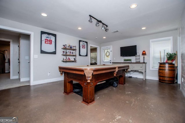 recreation room with finished concrete flooring, baseboards, recessed lighting, and plenty of natural light