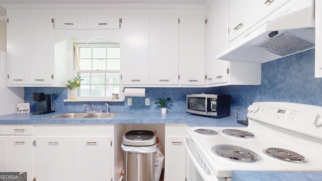 kitchen with white range with electric cooktop, under cabinet range hood, stainless steel microwave, a sink, and white cabinetry