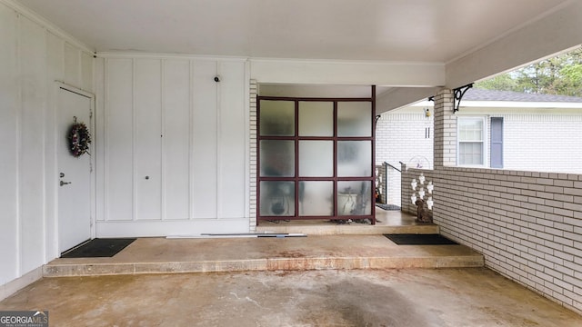 property entrance featuring board and batten siding