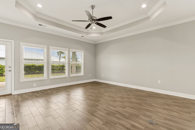 125 The Villas Way, Kingsland, GA 31548 - empty room with a raised ceiling, a ceiling fan, wood finished floors, crown molding, and recessed lighting