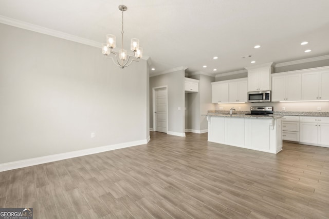 125 The Villas Way, Kingsland, GA 31548 - kitchen featuring stainless steel appliances, recessed lighting, ornamental molding, a chandelier, and baseboards