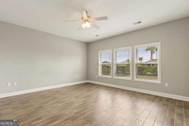 125 The Villas Way, Kingsland, GA 31548 - spare room with wood finished floors, a ceiling fan, and baseboards