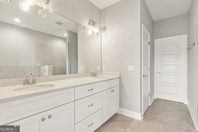 125 The Villas Way, Kingsland, GA 31548 - full bathroom featuring double vanity, tile patterned floors, and a tile shower