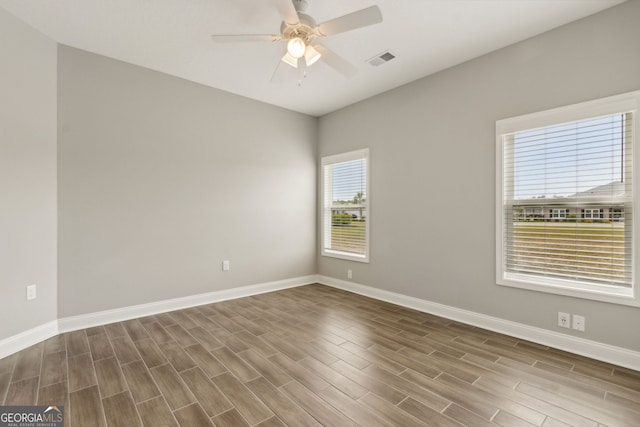125 The Villas Way, Kingsland, GA 31548 - spare room featuring wood finished floors, baseboards, and ceiling fan