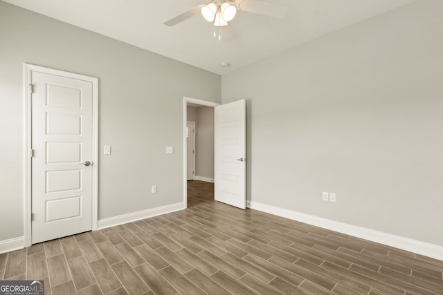 125 The Villas Way, Kingsland, GA 31548 - unfurnished bedroom with wood finished floors, baseboards, and ceiling fan