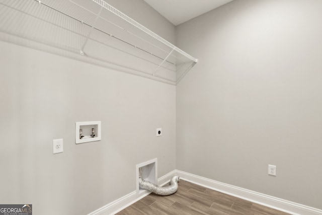 125 The Villas Way, Kingsland, GA 31548 - washroom featuring electric dryer hookup, wood finished floors, and washer hookup