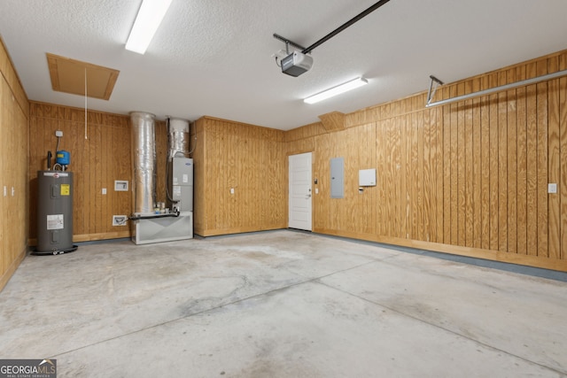 125 The Villas Way, Kingsland, GA 31548 - garage with water heater, a garage door opener, electric panel, heating unit, and wooden walls