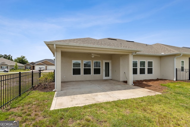 125 The Villas Way, Kingsland, GA 31548 - rear view of house featuring a ceiling fan, stucco siding, a shingled roof, and a patio area