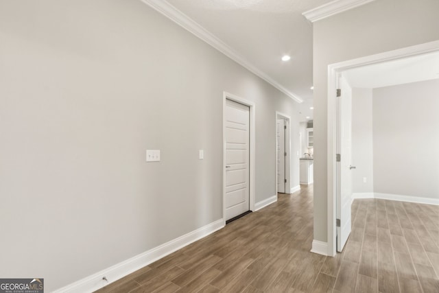 125 The Villas Way, Kingsland, GA 31548 - hallway featuring crown molding, recessed lighting, wood finished floors, and baseboards